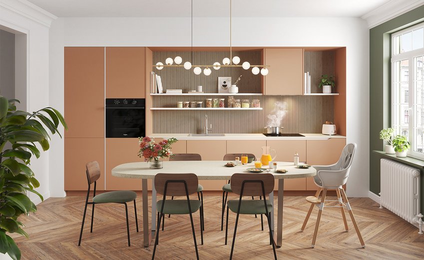 Moderne en kleurrijke keuken, open naar een eetgedeelte met een grote eettafel﻿