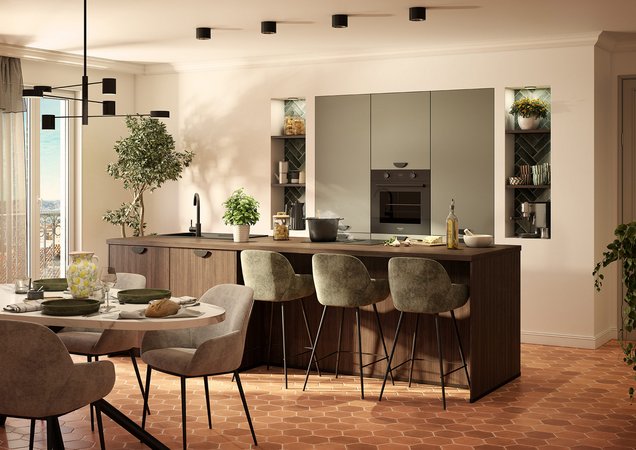 Moderne keuken in saliegroen en donker hout, met een groot kookeiland met barruimte, en verlichte decoratieve nissen.